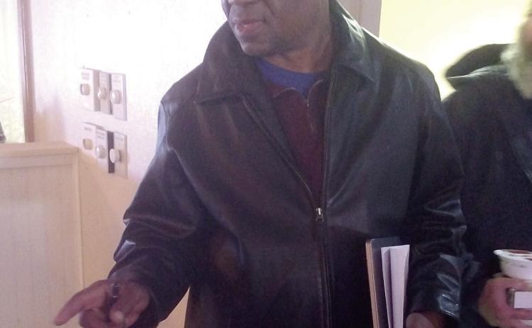 Pastor David Henry with Higher Ground Church works to prepare space to house those in need during the subzero temperatures. Countywide &amp; Sun/Bill Rooth
