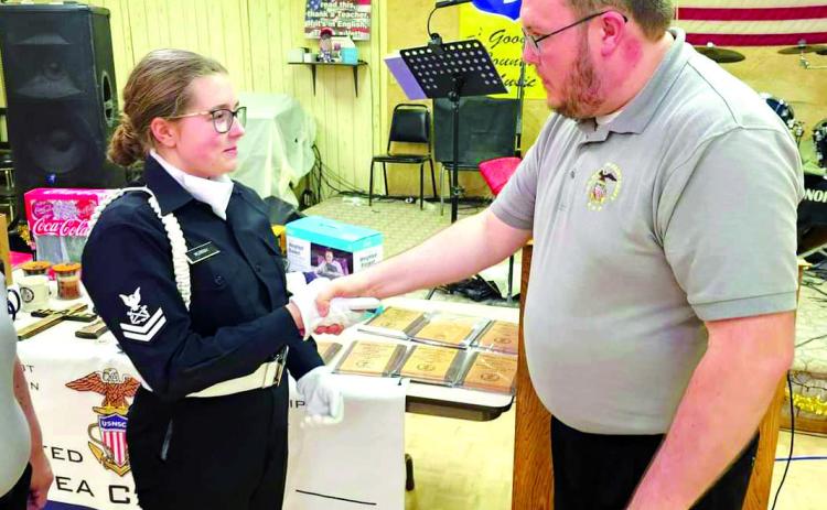 Training Ship Oklahoma Commanding Officer Alex Murray presents his daughter Petty Officer Diana Murray with the Leaguer of the Year Award during the U.S. Naval Sea Cadet Awards, held at the Tecumseh American Legion Post #260 on Sunday, Dec. 17. Photo provided by Donna Snodgrass.