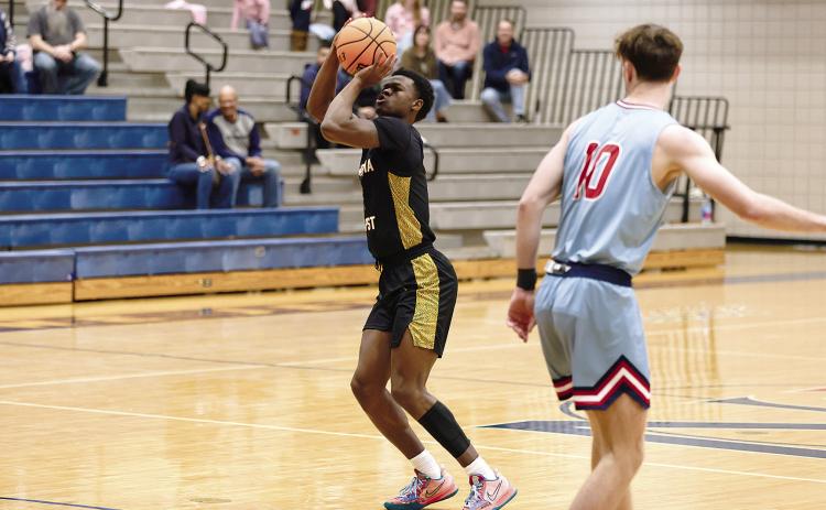 OBU’s Ricky Brown puts up a shot from beyond the arc. Brown contributed 14 points toward the 87-70 win over the Newman Jets Friday, Nov. 22. The Bison will travel to take on Dallas Baptist Nov. 29 with tipoff at 5 pm. Photo provided by OBU