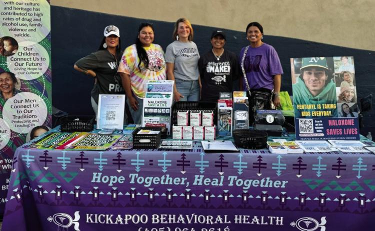 Shawnee Public Schools in collaboration with Kickapoo Behavioral Health, the Absentee Shawnee Tribal Opioid Response team, and Gateway to Prevention &amp; Recovery set-up naloxone distribution tables at every home football game this season. Pictured above, Cindy Bartley, Shawnee Public Schools Coordinator of Prevention Services is pictured with Kickapoo Behavioral Health, and Melissa Baptiste. Photo probided by SPS
