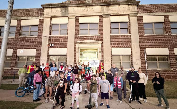 Horace Mann students, families and volunteers pose together on National Walk to School Day. Photos Provided by SPS