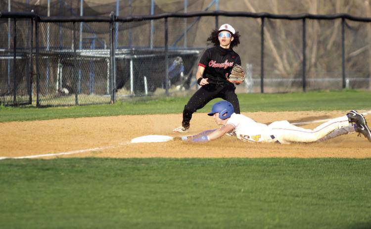 During the second game with Okmulgee on March 24, Bethel senior Roger Brooks dives to steal third base and is safe. The Wildcats won both games in the double header, 16-2 and 16-5. Natasha Dunagan, Countywide & Sun