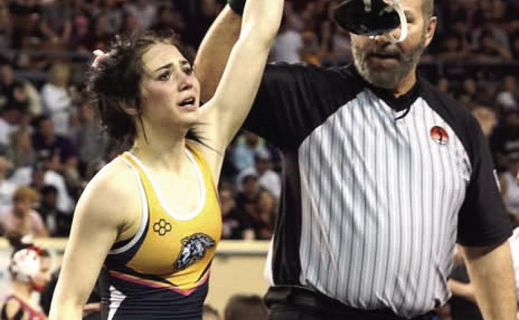 Tecumseh senior Vivian Hayes is declared the winner of her match in the 105 weight division of the OSSAA Class 5A Girls Wrestling State Championship on March 1 at the State Fair Arena. Hayes is the first girls wrestling state champion at Tecumseh High School. Photo provided
