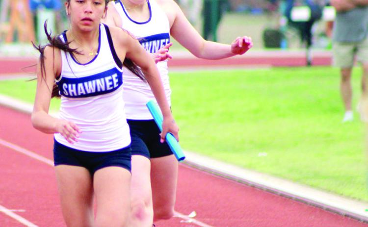 Gracyn Simpson hands the baton off to Aniya Kowena during a relay race at the OBU Invite on April 4. Countywide & Sun/Natasha Dunagan