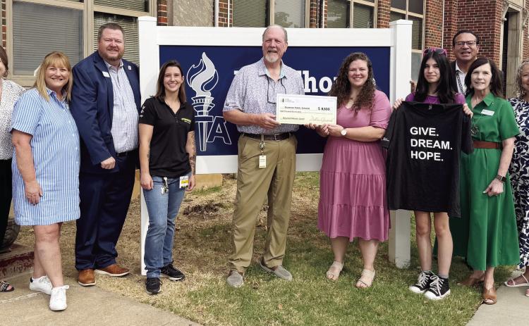 Shawnee Public Schools Administration is pictured with Jim Thorpe Academy Principal Hannah Holland, Dollar General District Manager Bill Dockum, and local manager Lexi. Photo Provided