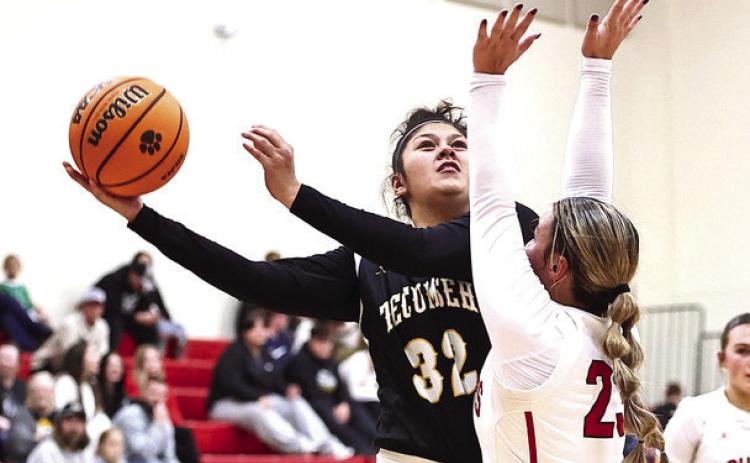 North Rock Creek's Jaxtyn Ratcliff puts the pressure on Tecumseh's Sadie Winlock in the game against Tecumseh. NRC won the match-up 57-32 improving to 6-0. Photo provided by Gowin Photography