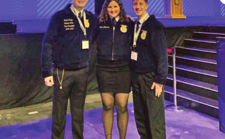 Tecumseh FFA members Jacob Nunley, Kylee Akehurst, and Caleb Blair pose during the National FFA Convention and Expo in Oct. They were three of nine members in Pottawatomie County who received their American FFA Degrees this year. Emily Loman, also of Tecumseh, is not shown. Photo provided.