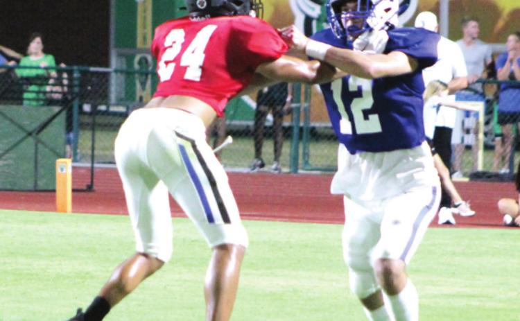 Bethel graduate and wide receiver John Gordon blocks a player on the West Team during the All-State Football game on July 29 at OBU’s Crain Family Stadium. Countywide &amp; Sun/Natasha Dunagan