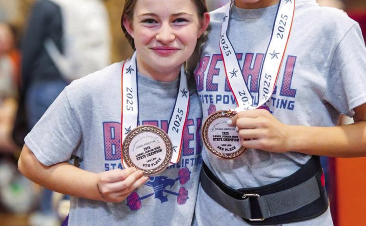 Picctured above from left is Kinsley Dunsworth and Evva Baker after receiving their medals. Photo provided by Coach Joey Ginn