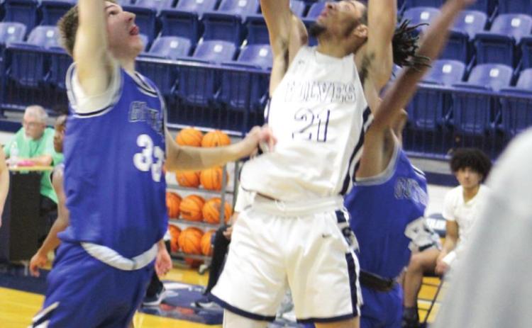 Shawnee’s Kayden Shaw goes to the bucket during the third quarter of the home game against Guthrie on Jan. 4.