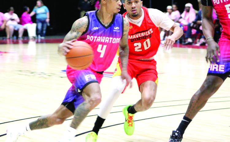 The Potawatomi Fire’s Chuck Guy drives to the basket during the Pink Out for Cancer and “Shawnee Strong” for disaster relief game with the Shreveport Mavericks on April 21. Guy led the Fire with 29 points, 13 rebounds, and six assists in the game, which was won by the Fire, 122-103, according to their Facebook page. Countywide &amp; Sun/Natasha Dunagan