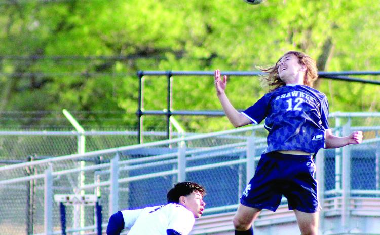 Shawnee sophomore Jax Martin keeps the ball in play with a header during the Apr. 8 home game with Nathan Hale. The Wolves won, 2-0. Natasha Dunagan, Countywide & Sun