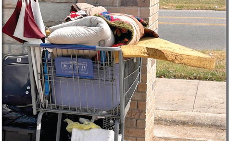 This shopping cart holds all the possessions of someone living on the streets in Shawnee. Countywide &amp; Sun/Suzie Campbell