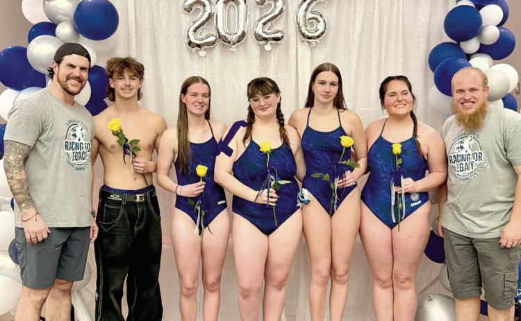 The Shawnee High School Swim Team Seniors were honored during the meet with Harrah and Choctaw at the YMCA on Jan. 13. Shown with Coach Stephen Ford, left, and Coach Nolan Price, right, they are, from left, Dravin Little, Kiley Sartin, Kelly Templeton, Tennille Kidd and Jadelyn Shotts. Photo provided by Shawnee Public Schools