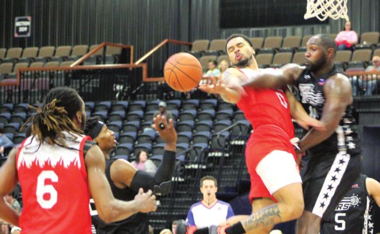 Potawatomi Fire Point Guard DeShawn Munson (#0) passes the ball to Center Anthony Allen (#6) during the third quarter of the home game against the Rockwall 7ers on May 6 at FireLake Arena. The Fire won 124-116. For more information, visit their website at potawatomifire.com.