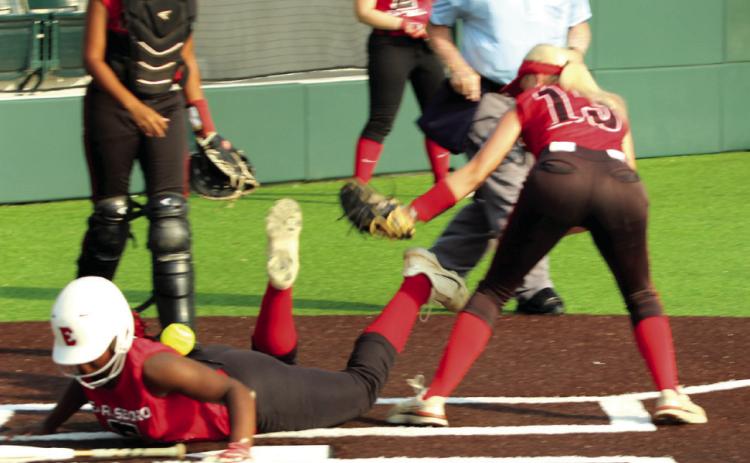 Earlsboro freshman Zory McGregor dives into home, as Macomb sophomore Rylee Hancock tries to tag her but loses the ball during the Little River Conference Tournament game on Sept. 4. Earlsboro junior Payten Gentry stole home shortly after McGregor. The Lady Wildcats beat the Lady Hornets, 6-2, in addition to winning three more games to become tournament champions. Natasha Dunagan, Countywide &amp; Sun