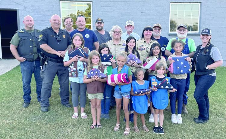 Members of the American Legion, Post 244 and the Cub Scout Troop 477, both in McLoud. The two organizations held a Flag Retirement Ceremony. A member of the American Legion said there were so many flags received that it was impossible to retire all of them in one evening. We will watch for another ceremony to be held in the near future. Photos provided by Monica Poindexter