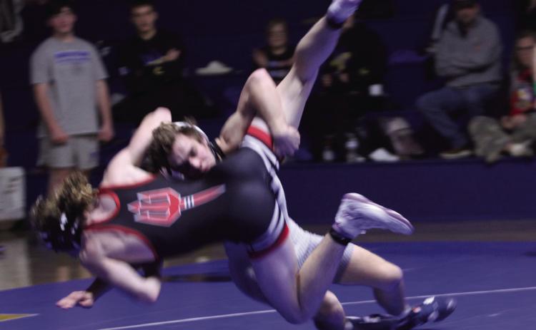 Natasha Dunagan, Countywide &amp; Sun Bethel's Eli Owens takes down Prague's Samuel Tape in the 144 weight class during the dual at Bethel on Dec. 18. Despite this move, Owens lost this match, and overall, Prague's Red Devils beat Bethel's Wildcats 21-39.