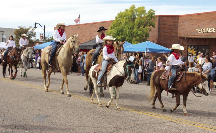 Members of the Tecumseh Round-Up Club ride their horses in the Frontier Days Parade on Sept. 28, 2024. They won second in the Club/ Organization category, and they held a rodeo that evening. File Photo