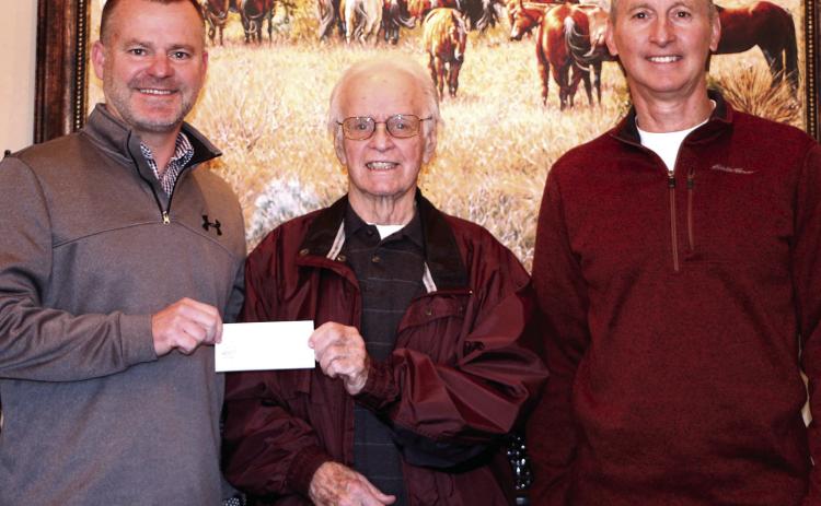 Dale Public Schools Superintendent Will Jones accepts a $6,500 check from Pottawatomie County Facilities Authority Chairman of the Trust Leonard Taron and Vice-Chairman Tom Wilsie on Dec. 14. Dale plans to use the funds for a new phone system. Photo provided by Matt Stephens.