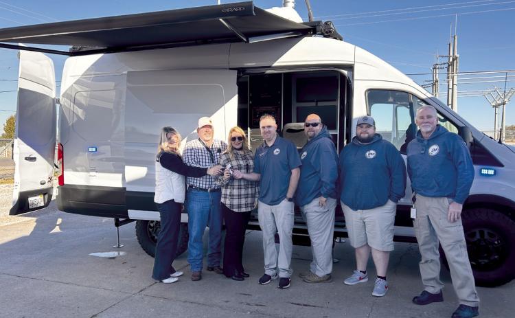 County Commissioners hand the key to the new Mobile Command Unit to Emergency Management Director Chad Larman. Pictured from left: Commissioners Abby Thompson (Dist. 3), Greg Rush (Dist. 2), Melissa Dennis (Dist. 1), Larman, Deputy Director Shane Colley, EM staff Isaiah Osborne, and Kurt Shultz. Countywide &amp; Sun/Suzie Campbell