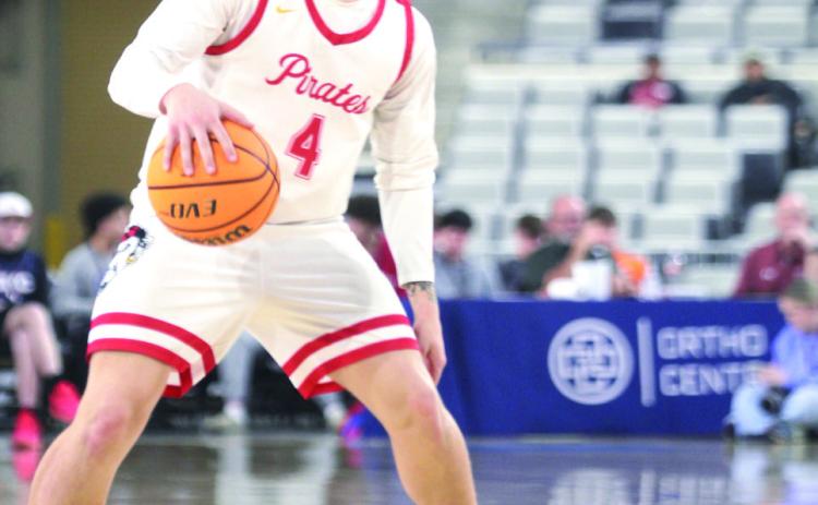 Dale senior Wyatt Seeley looks for an opening to pass during the Class 2A State Quarterfinal game against Vanoss on March 12. It was during this game that Seeley achieved his 1,000th career point. Natasha Dunagan, Countywide &amp; Sun