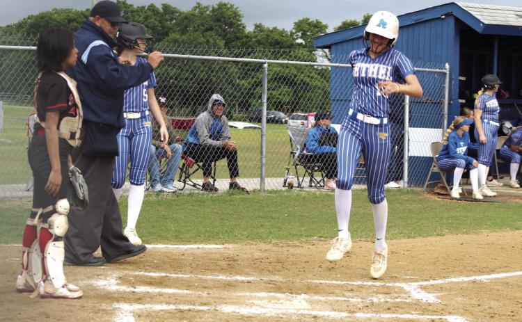 Bethel senior Layla Menhusen runs across the plate for a home run during the first home game against Okmulgee in the Class 5A District Slow Pitch Tournament on April 23.