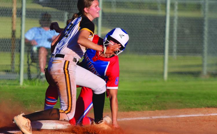 Tecumseh sophomore Madison Gray tries to protect third base as a Lady Lion slides onto it during the sixth inning of the Sept. 30 home game with Chandler. The Lady Savages won, 3-2. Countywide &amp; Sun/Natasha Dunagan