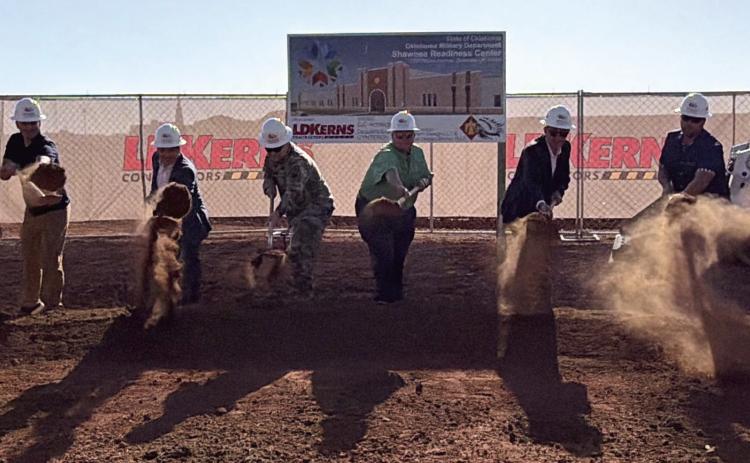 A ceremonial groundbreaking was held on the west side of the Shawnee Airport. This is the location of the new Oklahoma Military Department's Shawnee Rediness Center. Pictured from left are Lt. Col Montana Dugger, Shawnee City Commissioner Chris Odneal, Michael Hagan, Sen. Shane Jett, Maj. Gen. Thomas Mancino, Rep. Dell Kerbs, Matt Simpson, Shawnee City Manager Mark Simpson, and State Sgt. Maj. John Hernandez. Suzie Campbell, Countywide &amp; Sun