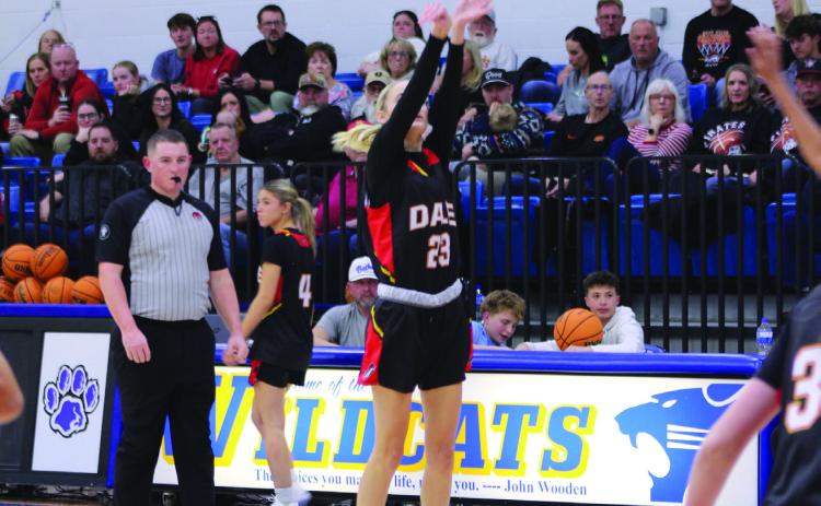 Dale senior Mika Monroe tries for a trey in the fourth quarter of the Lady Wildcats home game on Jan. 20.