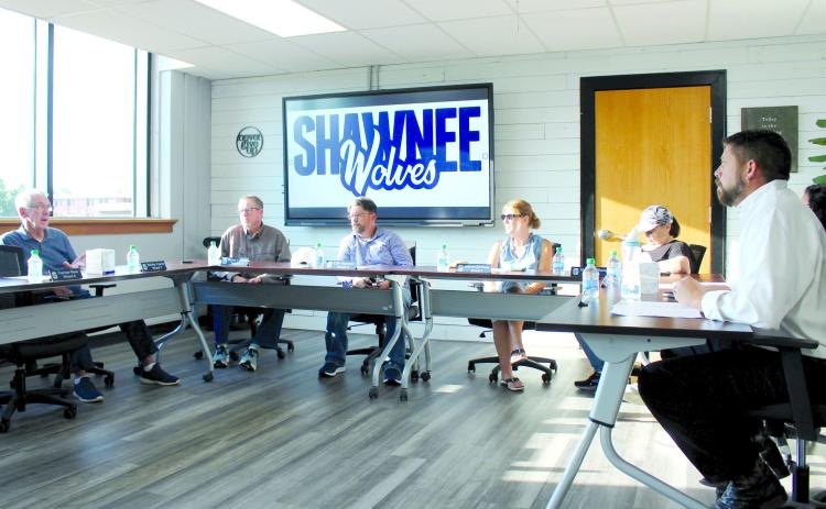 Shawnee Board of Education Clerk Bobby Canty, far left, speaks during the special session meeting at 8 a.m. on July 18. Also shown are Russ Oliver, Clif Harden, Jeanne Swinney, Mandy Hillhouse, Kristen Wilson (hidden) and Dr. Aaron Espolt. The meeting was held in the professional development center on the first floor of the Administration Building due to remodeling in the board room upstairs. Countywide &amp; Sun/ Natasha Dunagan
