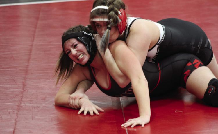 McLoud's Laine Walker gets the best of her Mustang match during the McLoud Redskin Rumble Girls Dual Championship on Jan. 20. McLoud High School hosted 16 teams for the fourth annual event. Broken Arrow was the final winner by criteria, after tying Bixby, 36-36, said McLoud Girls Wrestling Coach William Winters. McLoud was in the consolation bracket, having beaten Union, 51-24, and Mustang, 48-30, but falling to Del City, 30-39. Countywide & Sun/Natasha Dunagan