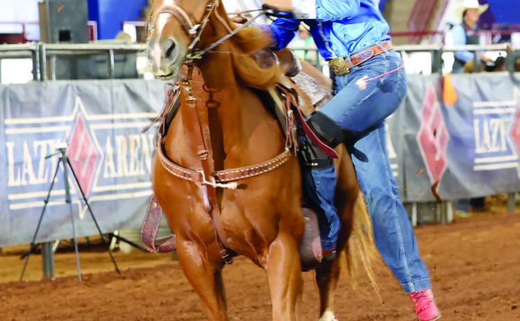 Tecumseh Middle School student Kambrie Koester competes on her horse, Quick Trip, in goat tying. Koester recently won Little Britches National Finals Rodeo Reserve World Champion Junior Goat Tyer. Photo provided