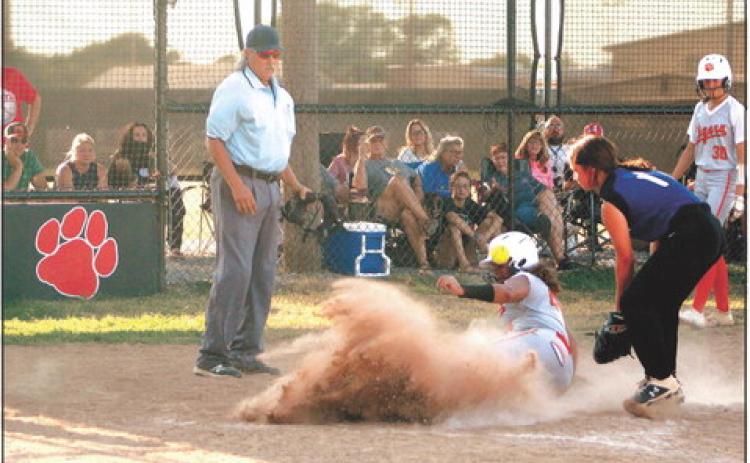 Maud’s Amerikus Street slides into home after stealing second and third, as the Bowlegs pitcher throws the ball to tag her too late. Maud won the home game on Aug. 25, 11-0. Countywide & Sun/Natasha Dunagan