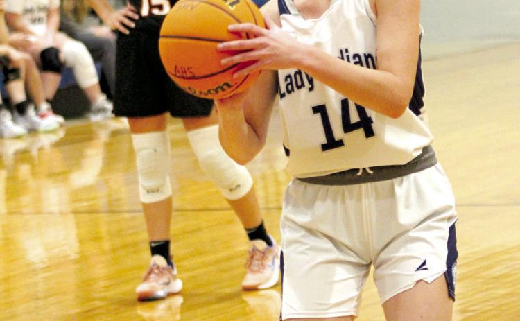 Asher’s Alexis Johnston aims for a foul shot during the home game on Nov. 10. The Lady Indians won, 52-22, and later that night, the Indians also won, 60-38. Countywide & Sun/Natasha Dunagan