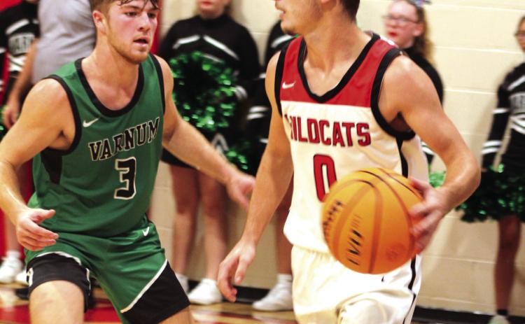 Earlsboro's Brayden Rawls looks for an opening to pass during the first quarter of the Nov. 7 home game against Varnum. The Wildcats lost 35-53.
