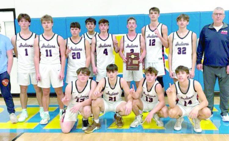 The Asher Indians, coached by Lee Reimer, pose after winning Class B Districts in Moss. They beat Moss on Feb. 15, 38-25, and will begin the regional competition on Feb. 21 at 7:30 pm, also in Moss. So far, their record is 20-3. Photo provided.