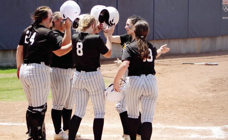Tecumseh’s Vivian Hayes celebrates at home plate with her teammates after hitting a home run in the third inning of the Class 5A Slow Pitch State Quarterfinals on May 2. The Lady Savages won that game with Cache, 15-5, and lost in the Semifinals to North Rock Creek, 13-18. They end their season with a record of 28-9, and a rank of #3. NRC went on to win in the finals. Countywide & Sun/Natasha Dunagan