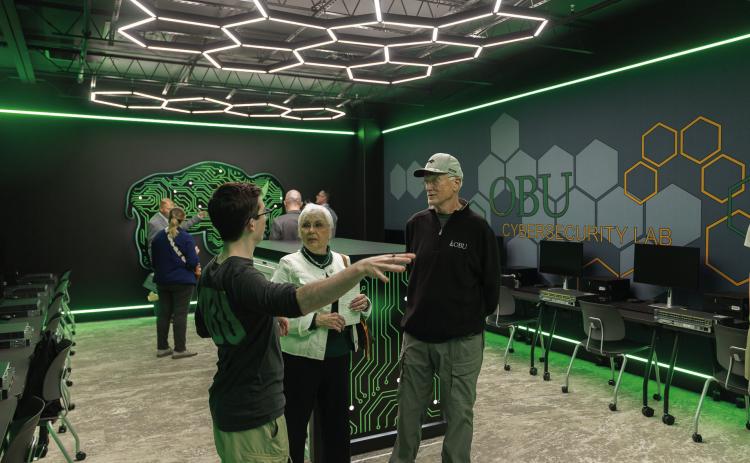 Guests tour the new cybersecurity lab inside Thurmond Hall following the March 6 ribbon-cutting ceremony at Oklahoma Baptist University. The lab features hands-on workstations with servers, routers and switches designed to give students practical experience in cybersecurity systems and network defense. Photo provided by OBU