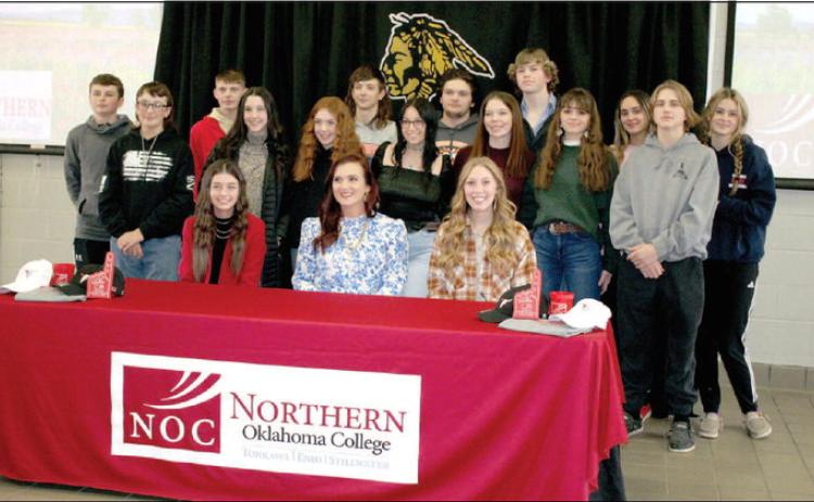 Tecumseh seniors Jocelyn Phelps, seated far left, and Marli Williams, seated far right, signed a letter of intent for livestock judging at Northern Oklahoma College on Jan. 20. FFA Advisor and agriculture teacher Dodge Nichols said this is the first livestock judging signing in the 10 years he has been at Tecumseh High School. Also shown, seated center, is Northern Oklahoma Livestock Judging Coach and Professor Jennifer Bedwell and, standing, the THS FFA Livestock Judging Team. Countywide & Sun/Natasha D