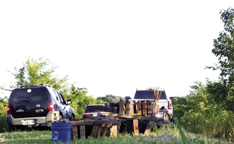 Hours before folks began to arrive for the show, Tracy Climer and his crew (primarily made up of his wife, son, and daughter-inlaw) begin unloading the gear, securing the tubes and clearing any trash from inside each tube. Photos by Suzie Campbell, Countywide & Sun