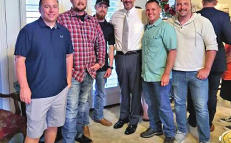 Pottawatomie and Lincoln county’s newly elected District Attorney David Hammer celebrates the win with local law enforcement officers during the watch party Tuesday evening. Photo provided