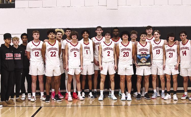 North Rock Creek Cougars pose with their championship trophy.