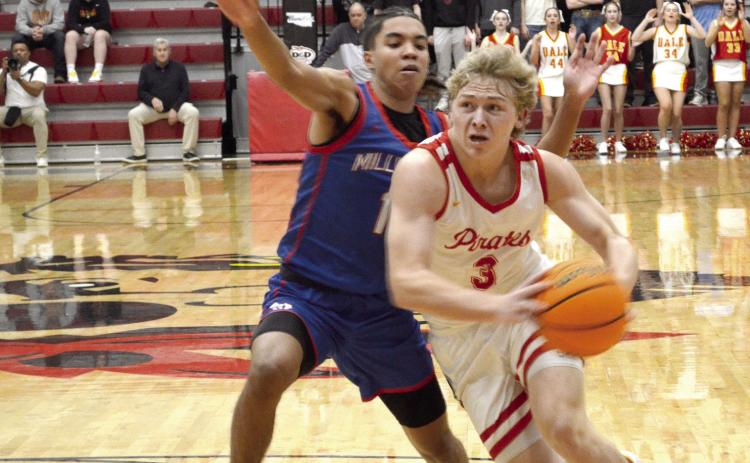 Dale junior Denton Forsythe drives to the basket during the Jan. 17 homecoming game against Millwood. The Pirates won, 64-57. Countywide & Sun/Jessica Jones