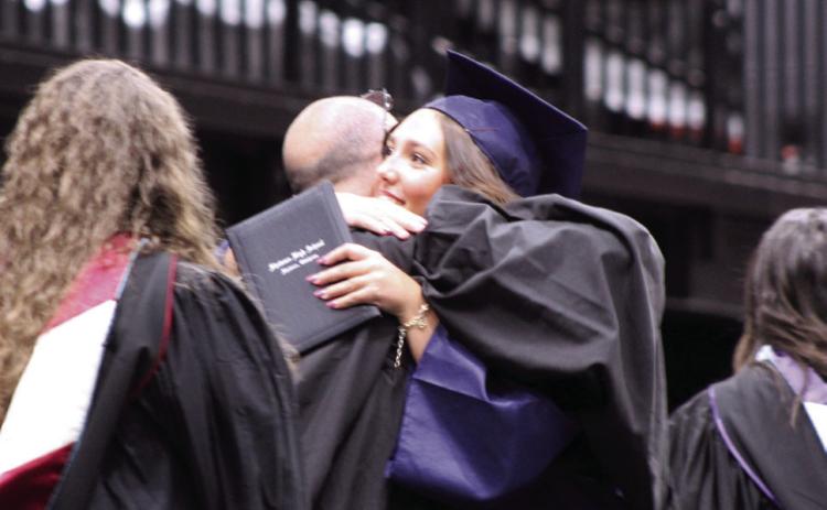 Alivia Cook gets a hug from her father, Shawnee High School Principal Bobby Cook. Photos by Natasha Dunagan, Countywide & Sun
