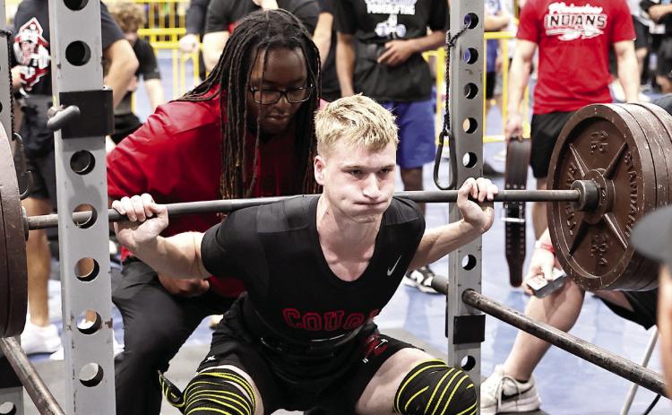 North Rock Creek's Kaiden Samuels squats 450 pounds. Samuels placed third in the 157 pound weight class. Photo courtesy of Gowin Photography
