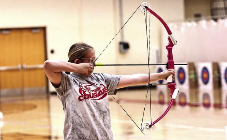 NRC Freshman Kimmy Bjorkley takes aim at the annual Veterans Weekend Shootout hosted at North Rock Creek Nov. 7-8. NRC High School and Middle School teams took first and the Elemenrary took second place. They are headed to Meeker's Annual Turkey Tournament, Nov. 14-15. Photo Courtesy of Gowin Photography
