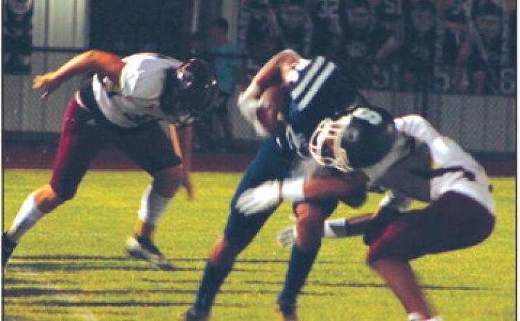 Shawnee sophomore Dace Shaw puts his shoulder into escaping a tackle during the home game against Blanchard on Sept. 16. The Wolves lost 13-40. Countywide &amp; Sun/Natasha Dunagan
