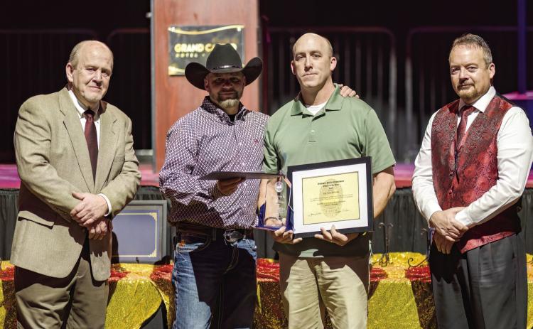 Cpl. Tom Williams (third from left) is awarded the 2022 Officer of the Year during the Shawnee Police Foundation Awards Banquest held at The Grand Casino Friday, Jan. 26. Pictured with Williams, from left, Shawnee Police Foundation Chairman Ken Stafford, 2021 Officer of the Year recipient Sgt. Russell Conner, and Shawnee Police Chief Mason Wilson. Photo by Workingman Photo.