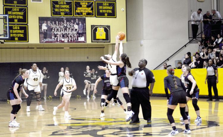 Cadence Leba tips off the senior night game against Harrah on Feb. 14, 2025. Countywide & Sun/Jessica Jones